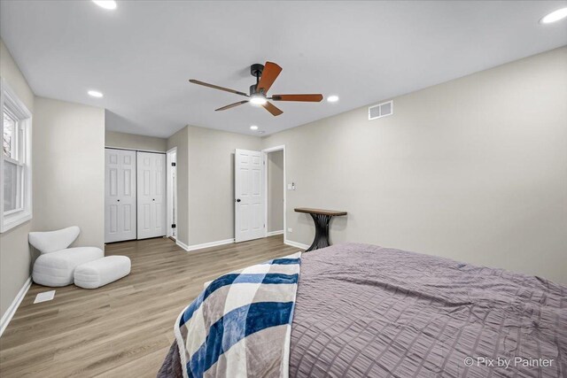 bedroom with ceiling fan, a closet, and light wood-type flooring