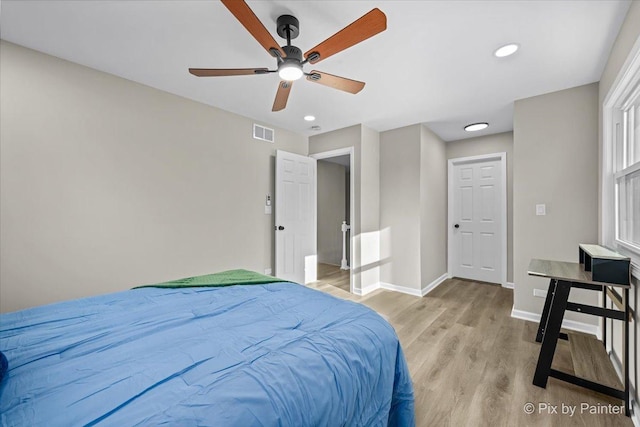 bedroom featuring ceiling fan and light wood-type flooring