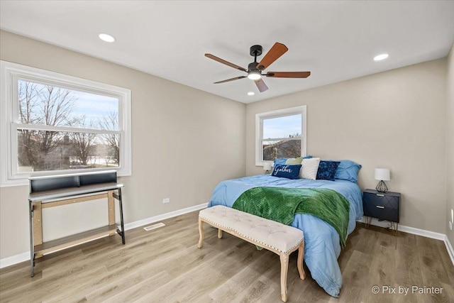 bedroom with light wood-type flooring and ceiling fan