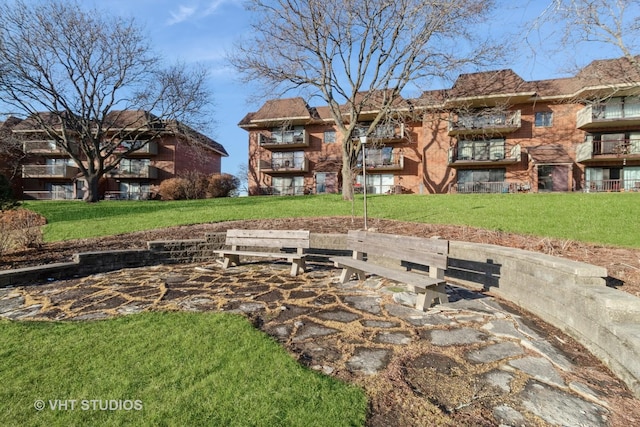 view of community featuring a lawn