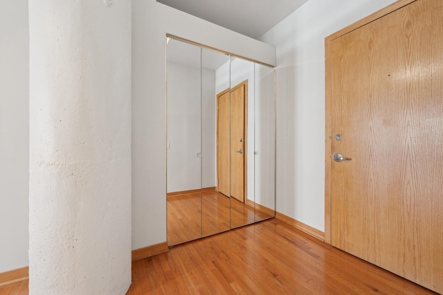 corridor featuring hardwood / wood-style flooring