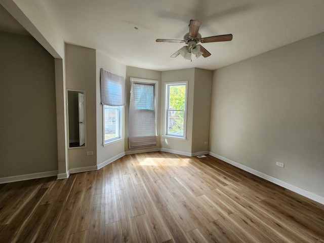 unfurnished room featuring ceiling fan and light hardwood / wood-style floors