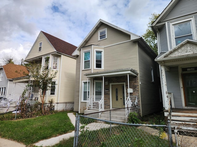 view of property featuring covered porch