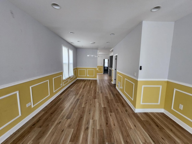 spare room featuring wood-type flooring