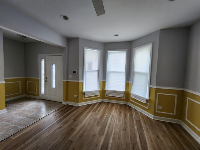 entrance foyer with hardwood / wood-style floors and a healthy amount of sunlight