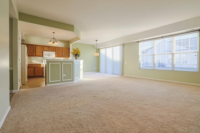 unfurnished living room featuring light colored carpet