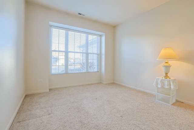 empty room with light colored carpet