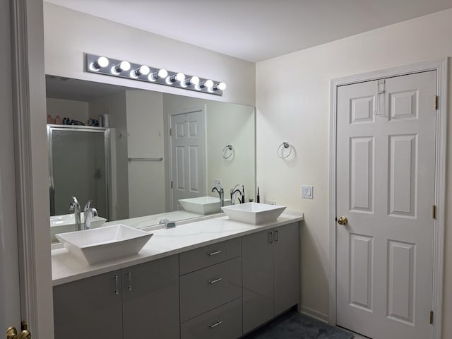 bathroom featuring vanity and an enclosed shower