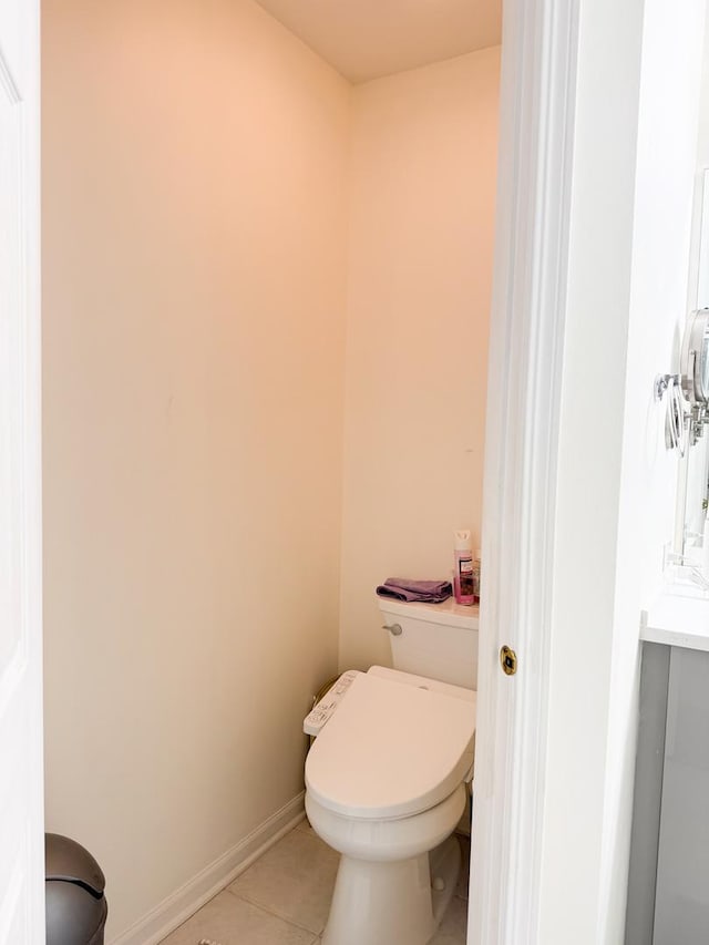 bathroom with tile patterned flooring and toilet