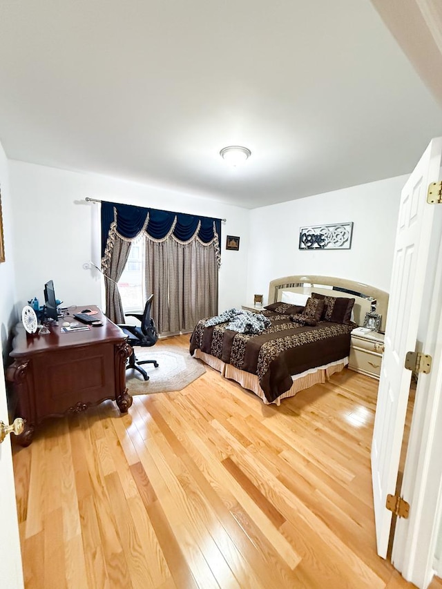 bedroom featuring wood-type flooring