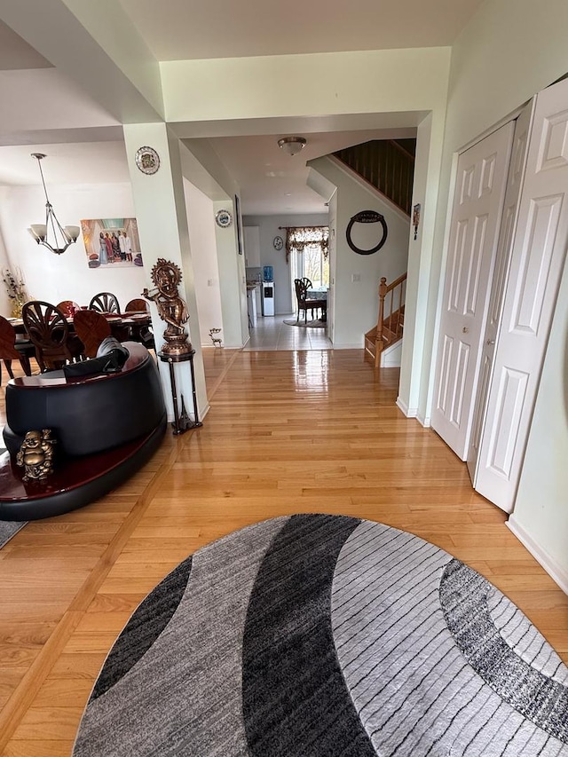 hall with hardwood / wood-style flooring