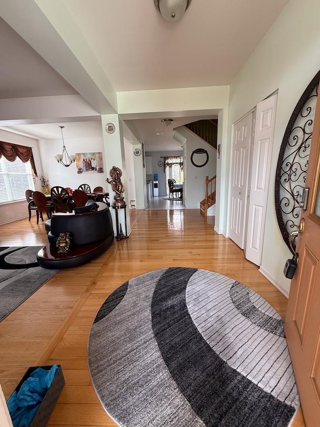 entryway with hardwood / wood-style floors