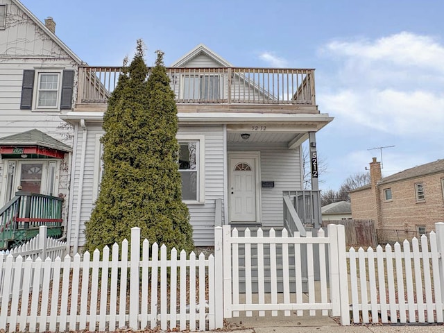 view of front of home with a balcony