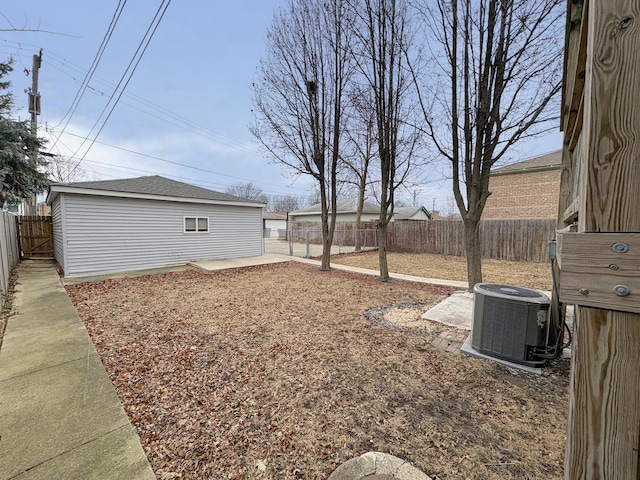 view of yard with a patio and central AC unit