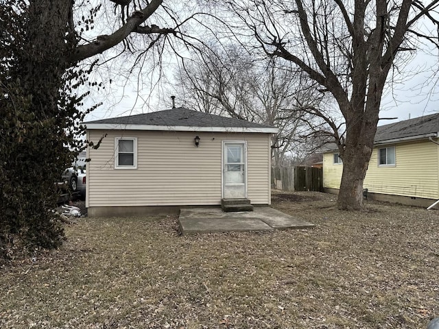 back of property with a patio