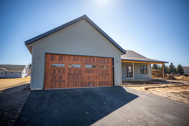 view of front of property featuring driveway and a garage