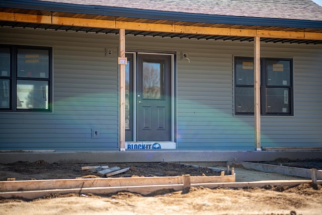 doorway to property with a porch