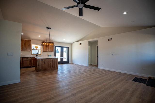 unfurnished living room with dark wood-style flooring, baseboards, vaulted ceiling, recessed lighting, and ceiling fan