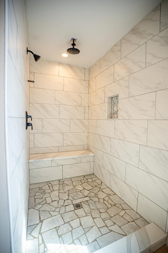 full bath featuring tiled shower