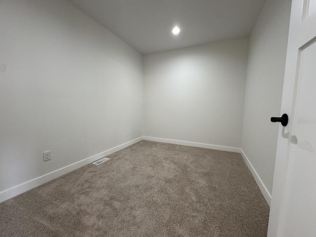 empty room featuring recessed lighting, visible vents, carpet flooring, and baseboards