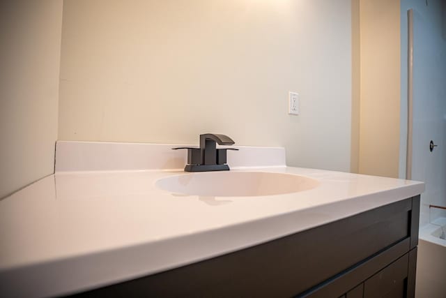 bathroom with vanity and a bathtub