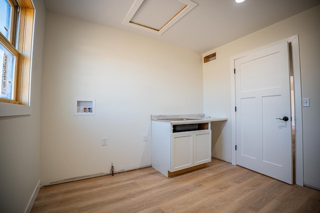 washroom with washer hookup, attic access, cabinet space, light wood finished floors, and recessed lighting