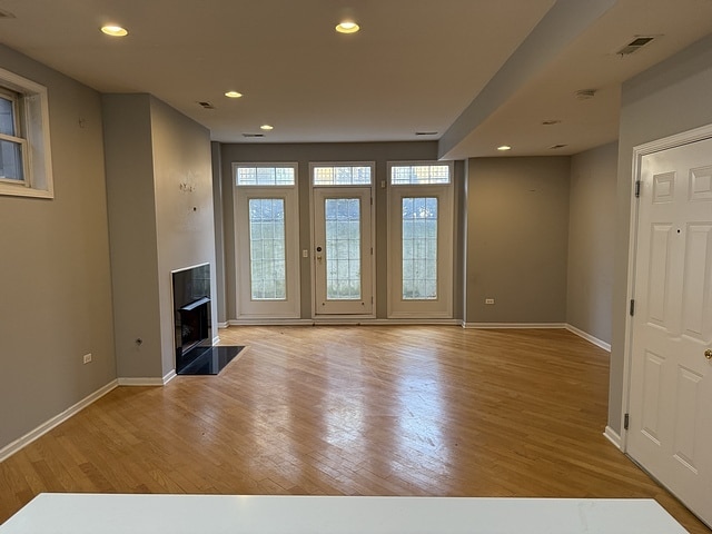 unfurnished living room featuring light hardwood / wood-style flooring