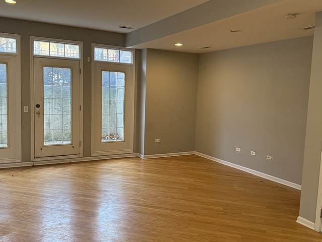 unfurnished room featuring light wood-type flooring