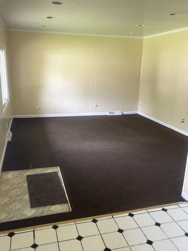 carpeted empty room featuring ornamental molding