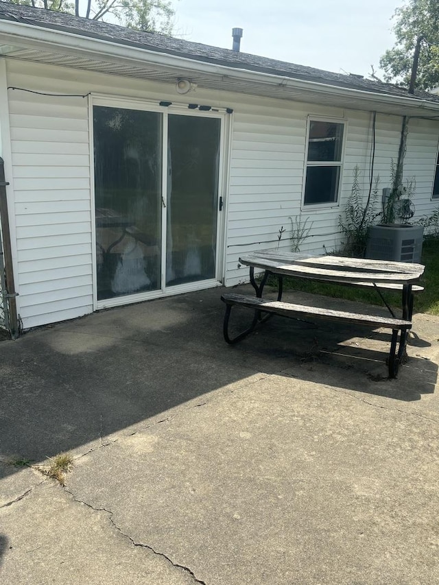 exterior space featuring cooling unit and a patio