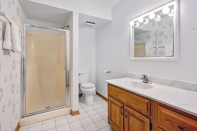 bathroom with a stall shower, visible vents, tile patterned floors, and vanity