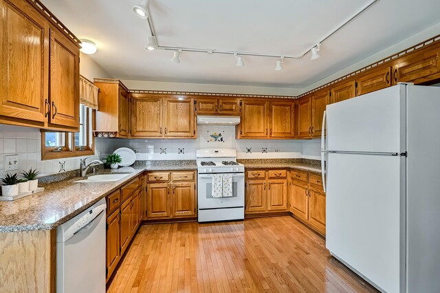unfurnished dining area featuring baseboards, visible vents, ceiling fan, and light wood-style floors