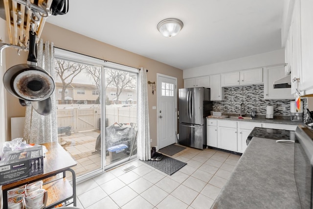 kitchen with white cabinetry, sink, tasteful backsplash, and appliances with stainless steel finishes