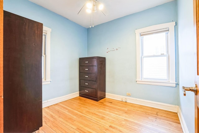 spare room with ceiling fan and light hardwood / wood-style floors