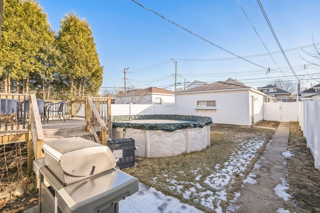 view of yard with a pool side deck