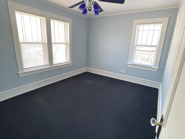 spare room with ceiling fan, ornamental molding, and baseboards