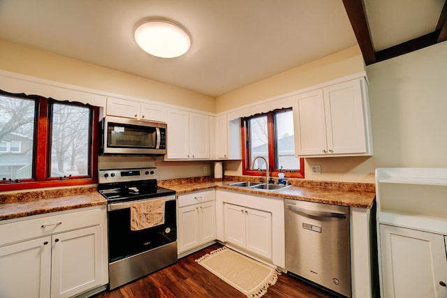 kitchen featuring white cabinetry, stainless steel appliances, and sink