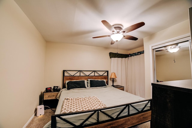 bedroom with ceiling fan and carpet floors