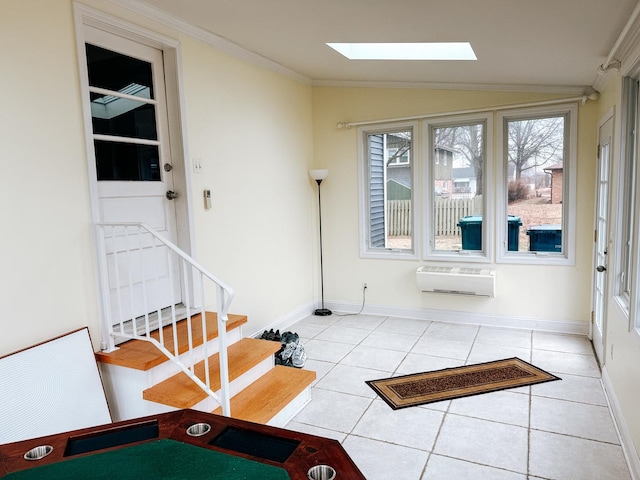 interior space with vaulted ceiling with skylight and a wall mounted AC