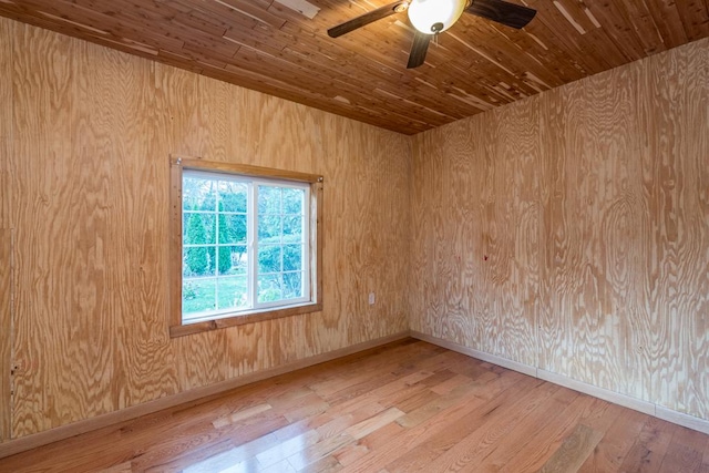 spare room with wooden ceiling, ceiling fan, and light hardwood / wood-style flooring