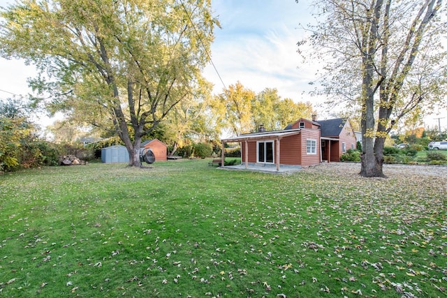 view of yard with a patio and a shed