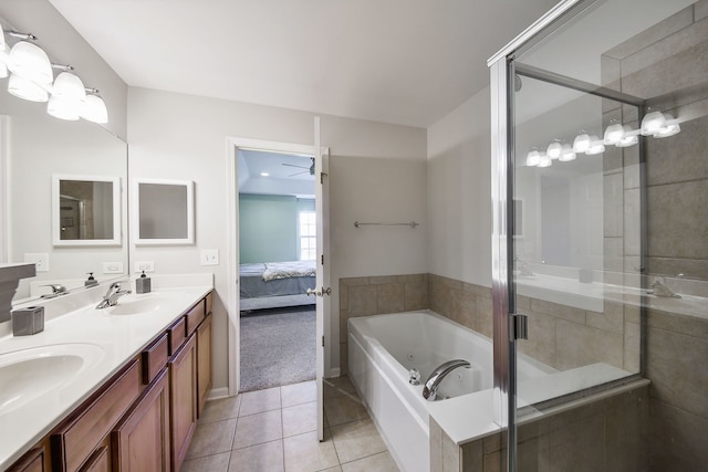 bathroom featuring tile patterned flooring, vanity, plus walk in shower, and ceiling fan