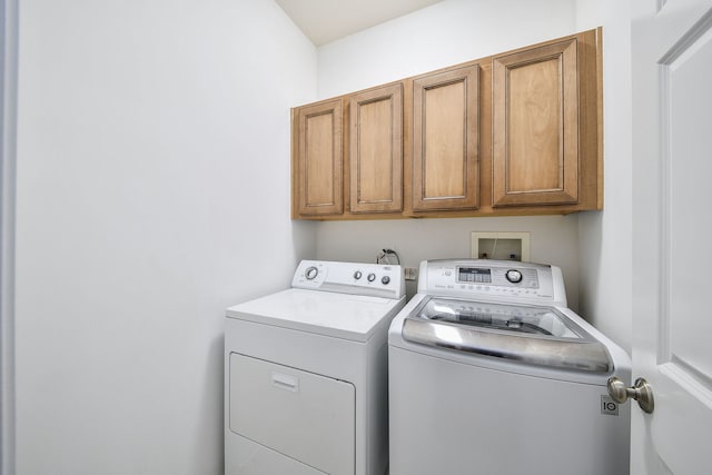 laundry area with cabinets and independent washer and dryer