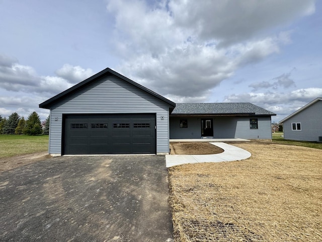 single story home with an attached garage and driveway