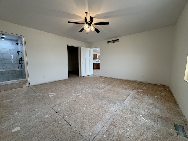unfurnished bedroom with visible vents and connected bathroom