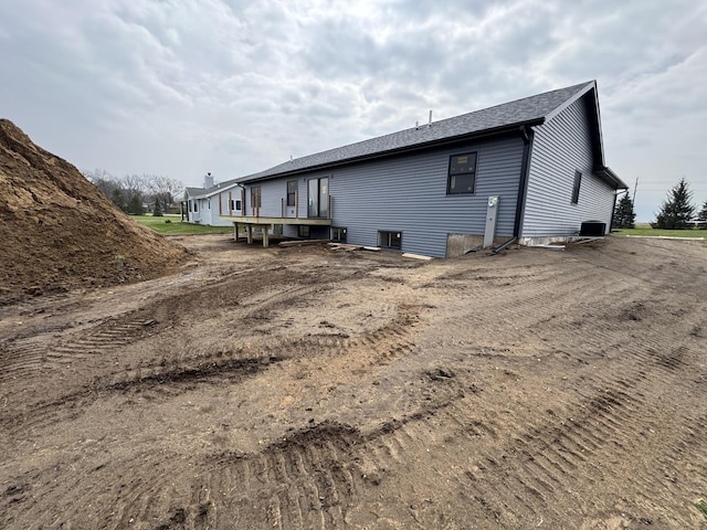 view of property exterior with central AC unit