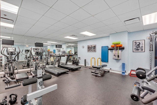 workout area with a paneled ceiling