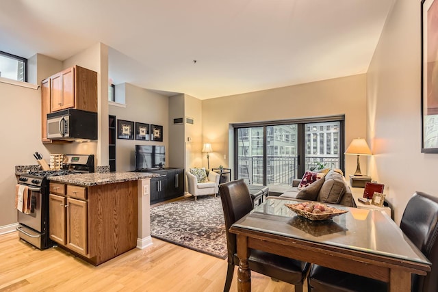 dining room with light hardwood / wood-style floors