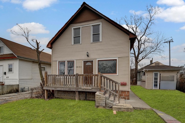 rear view of property with an outdoor structure and a lawn