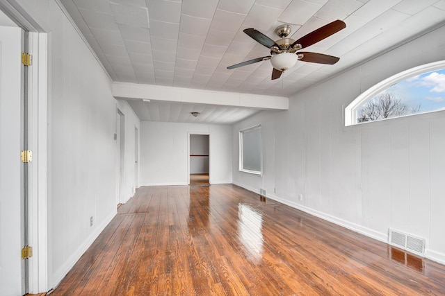 empty room featuring hardwood / wood-style flooring and ceiling fan